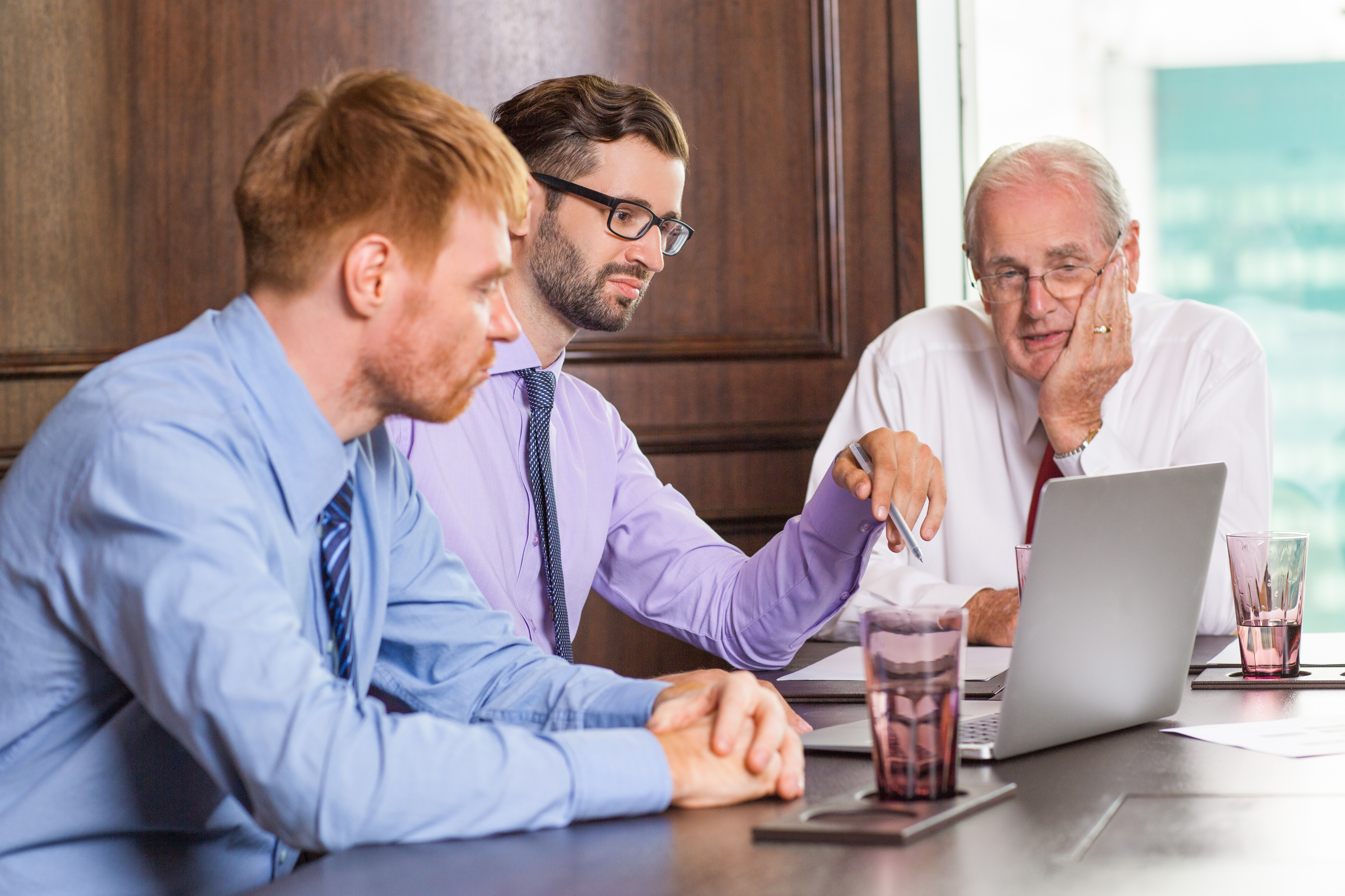 Relationship manager reviewing lender options with colleagues